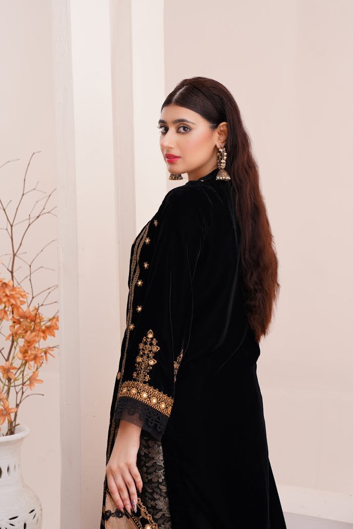 A stylish portrait of a woman in traditional eastern attire, showcasing elegance and cultural fashion.